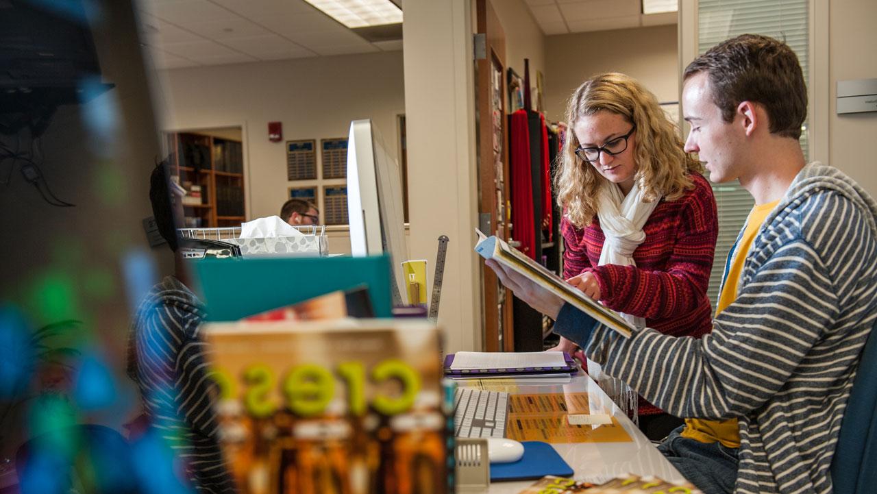 Two UE publication students working together on an upcoming edition of the Crescent Magazine